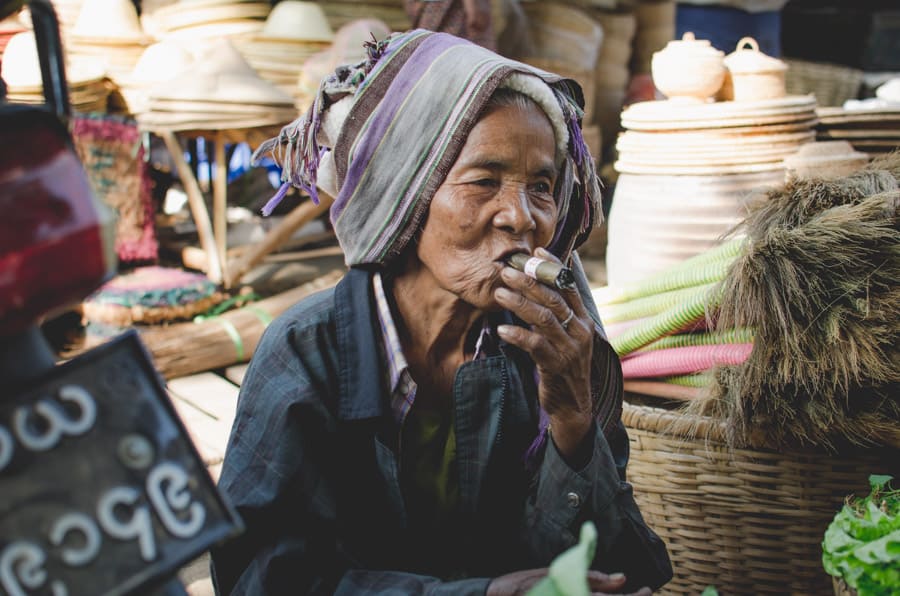 Woman smoking a cheroot in the market of Nyaung U near Bagan in Myanmar