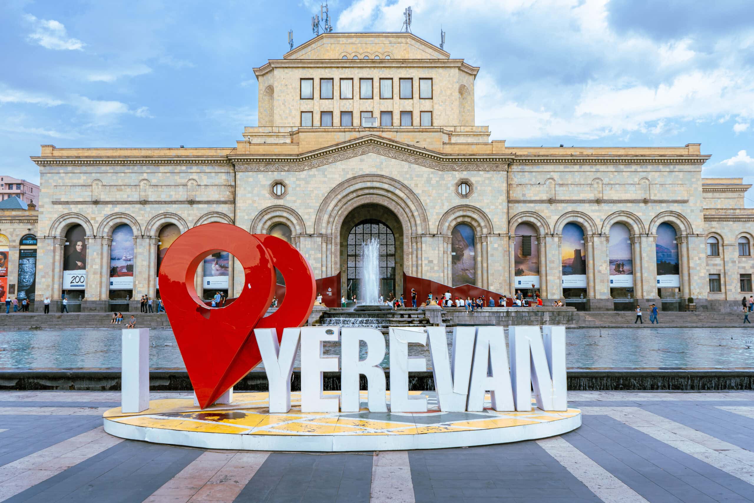 An I love Yerevan sign in front og the Singing fountains on. aclear summers day