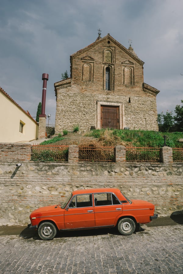 A Lada parked in fron of St George church in Sighnaghi, Georgia