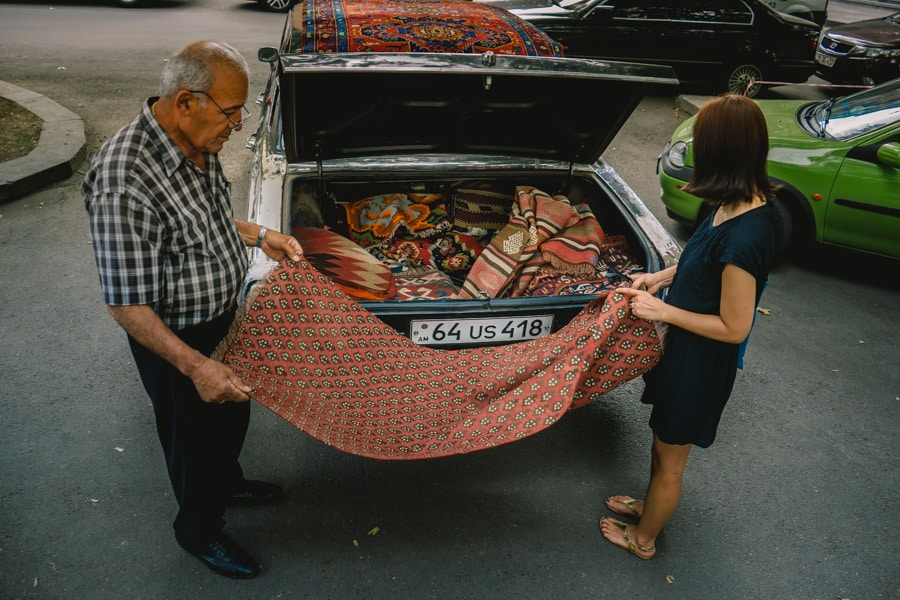 Buying carpets at the Vernissage market 