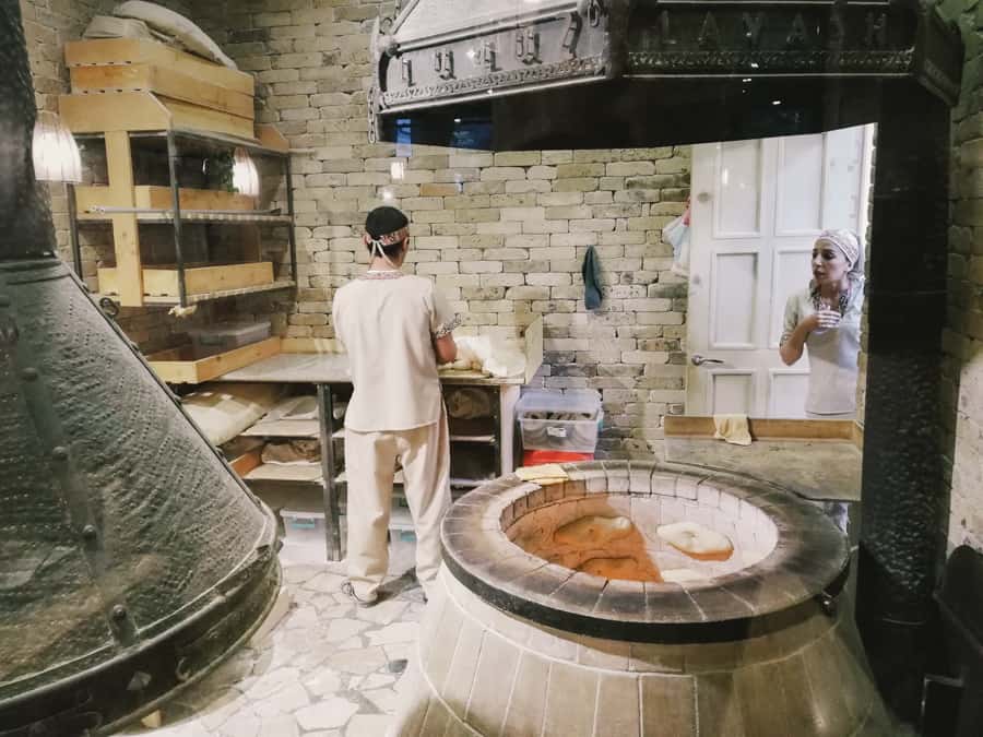 Woman baking lavash bread at Lavash Restaurant in Yerevan