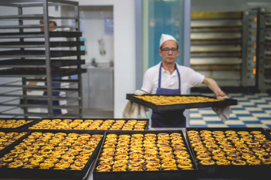 egg tarts in the bakery of Pasteis de Belem