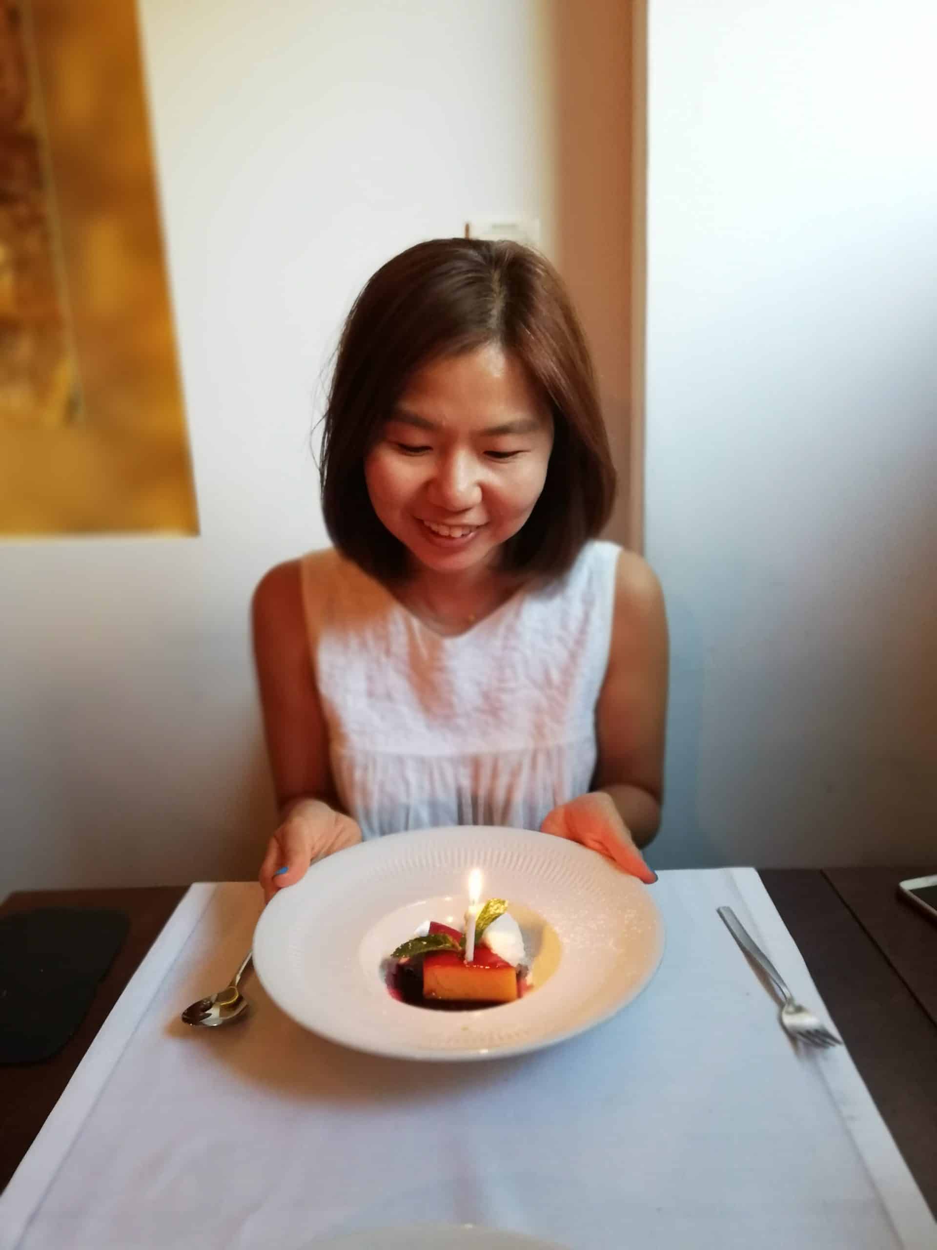 Jin with her little birthday dessert at Frade dos Mares in Lisbon