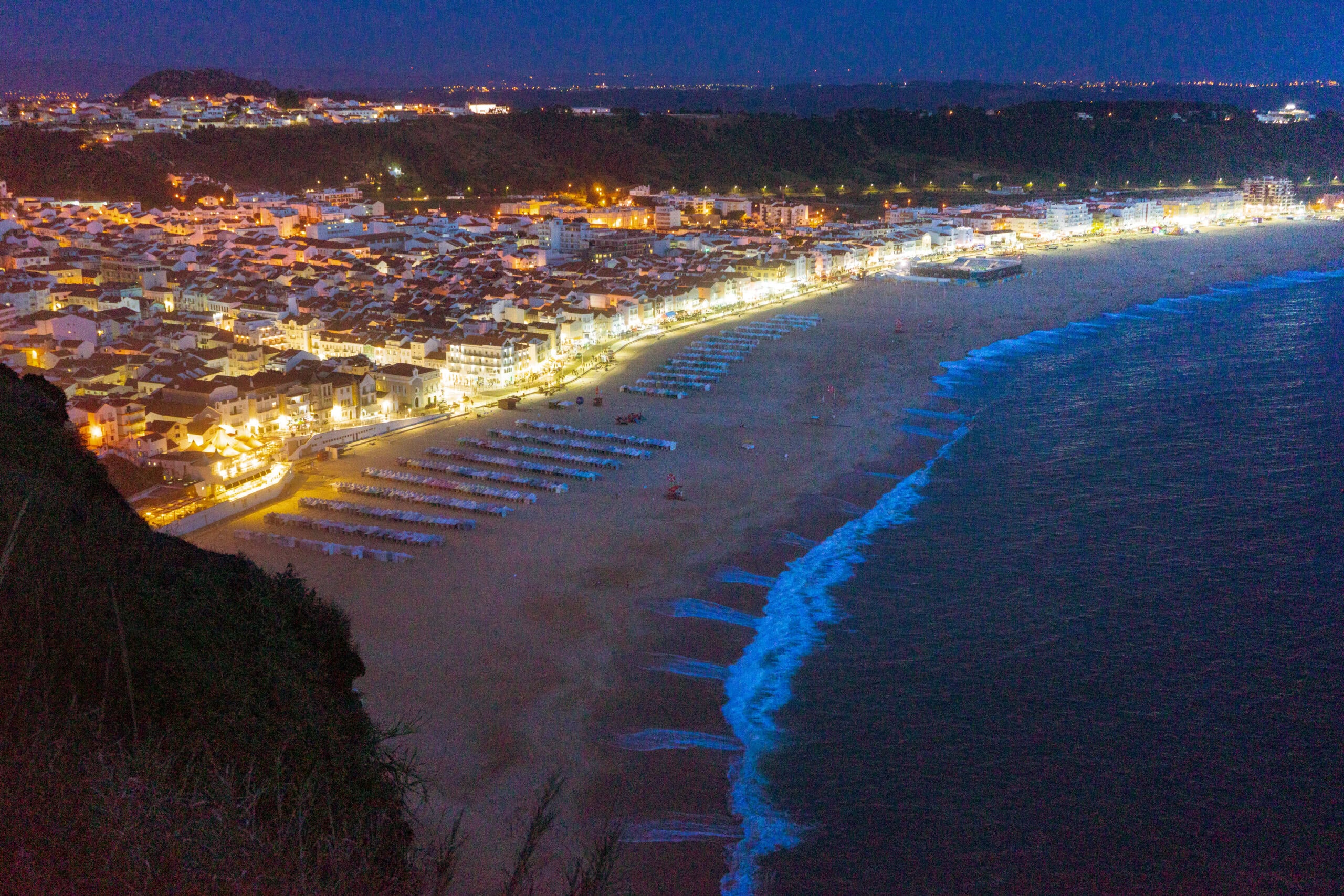View over Praia da Nazare at night as seen from the lighthouse