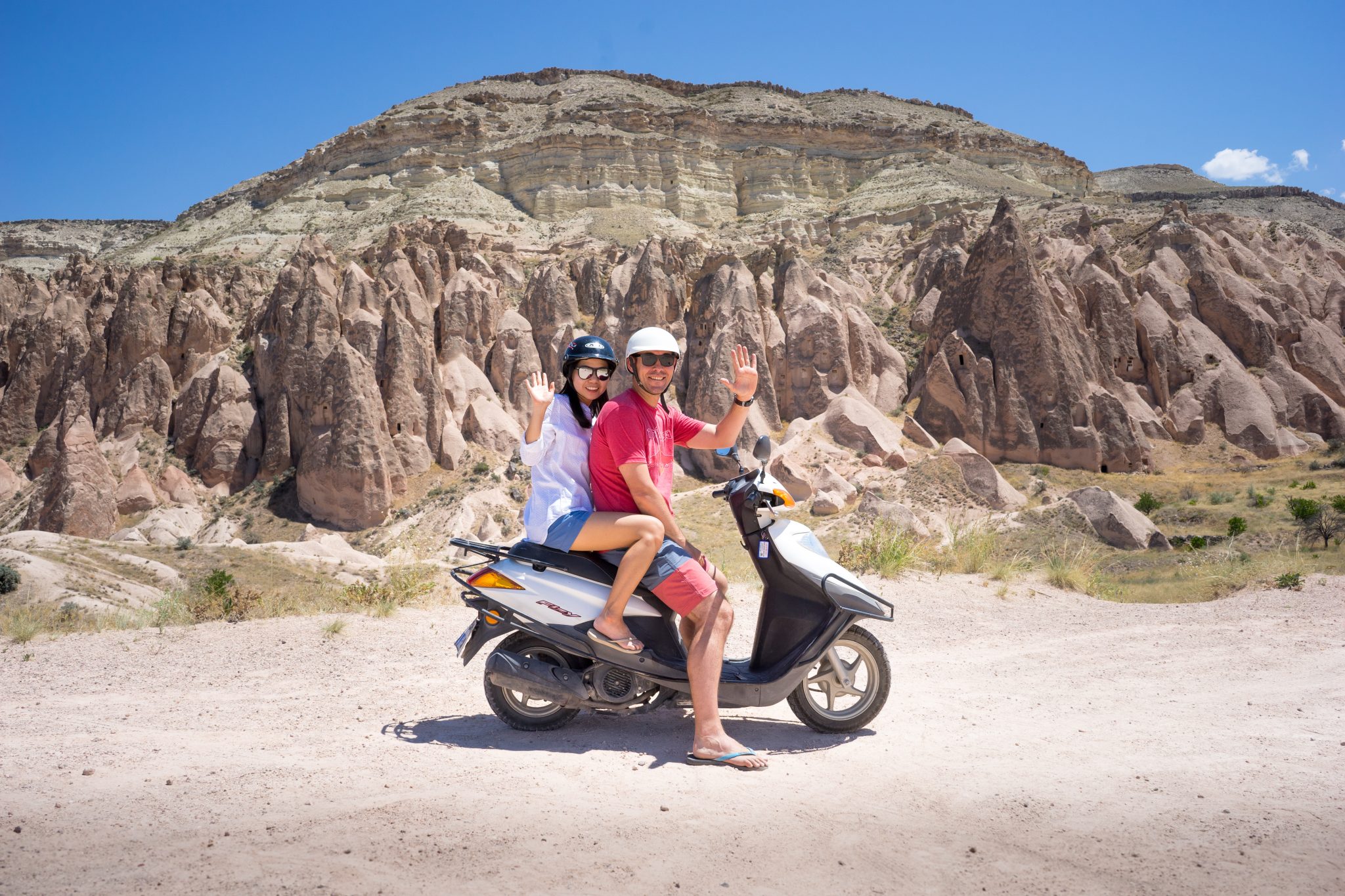 Museum of Wander Travel Blog: We are waving hello from our moped we rented to tour around Cappadocia in Türkiye