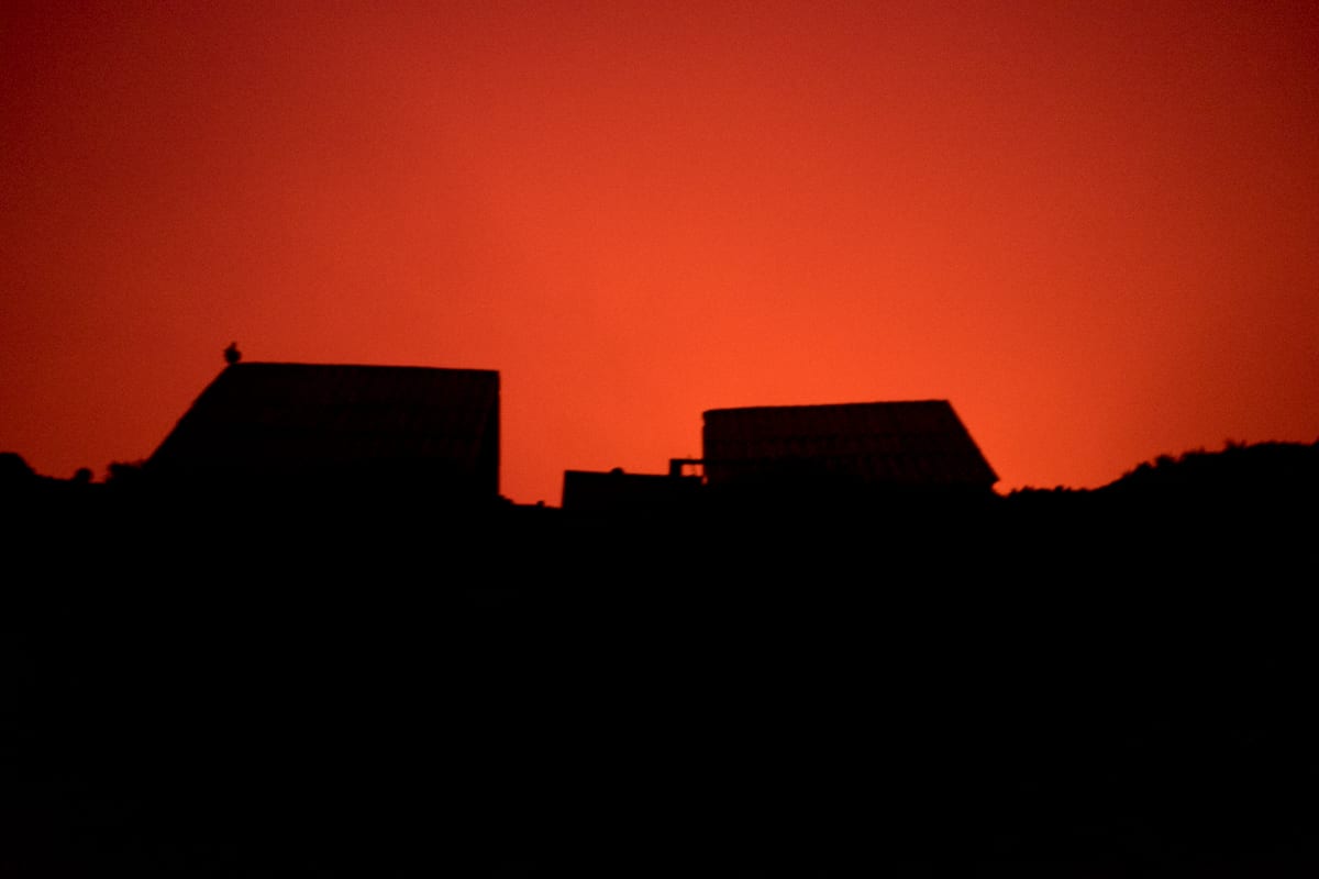 Virunga National Park shelters on Mount Nyiragongo in the glow of the lava, DRC