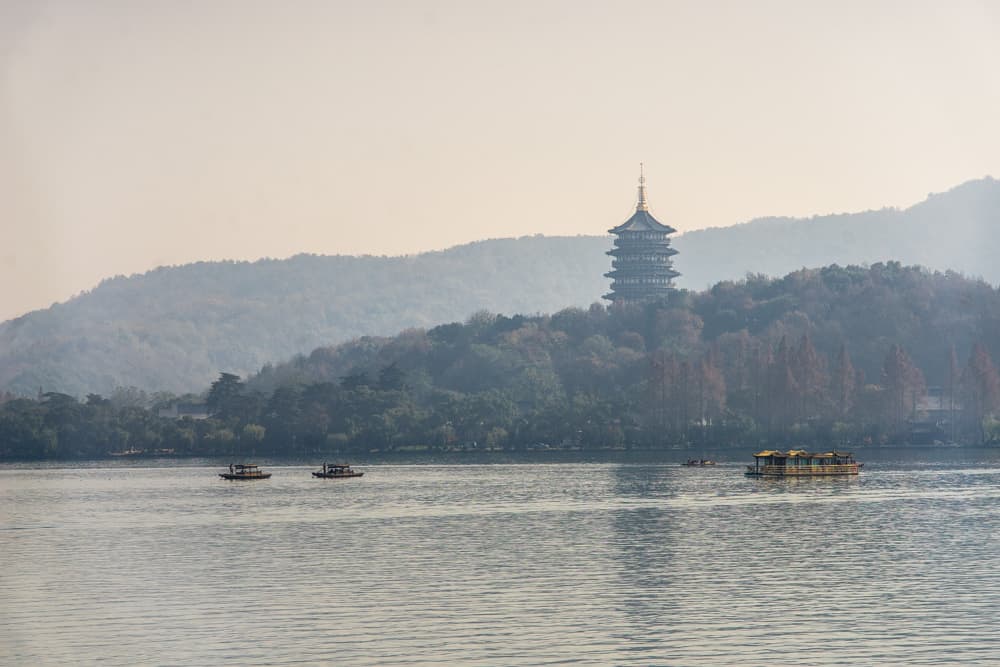 Boats on West Lake with Heifeng Pagoda in the bakground