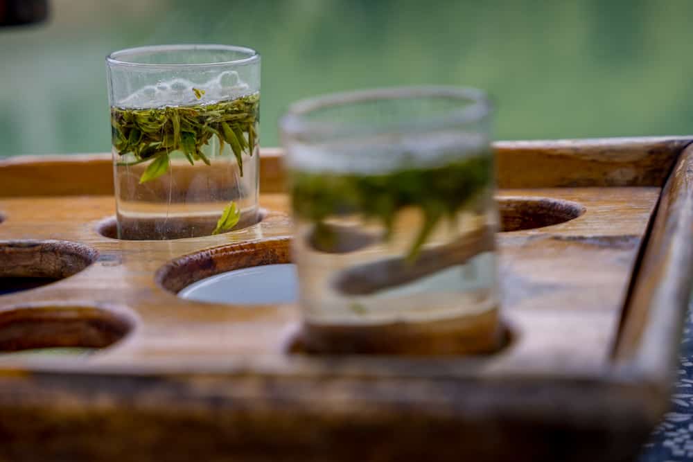 Drinking Dragon Well green tea while taking a boat ride through the Xixi wetlands 