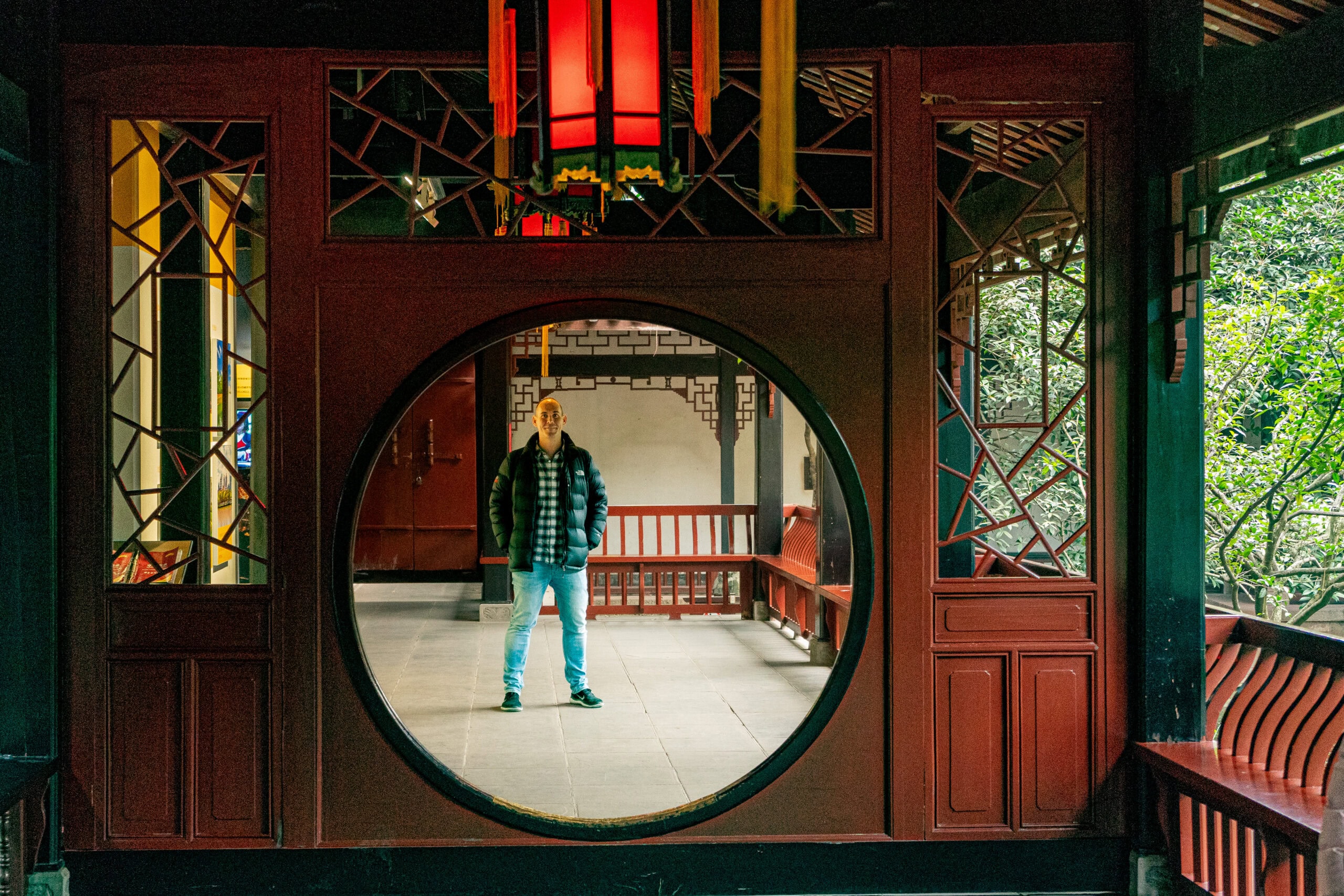 I am standing, framed inside a round moon door, at the Wuhou Temple in Chengdu