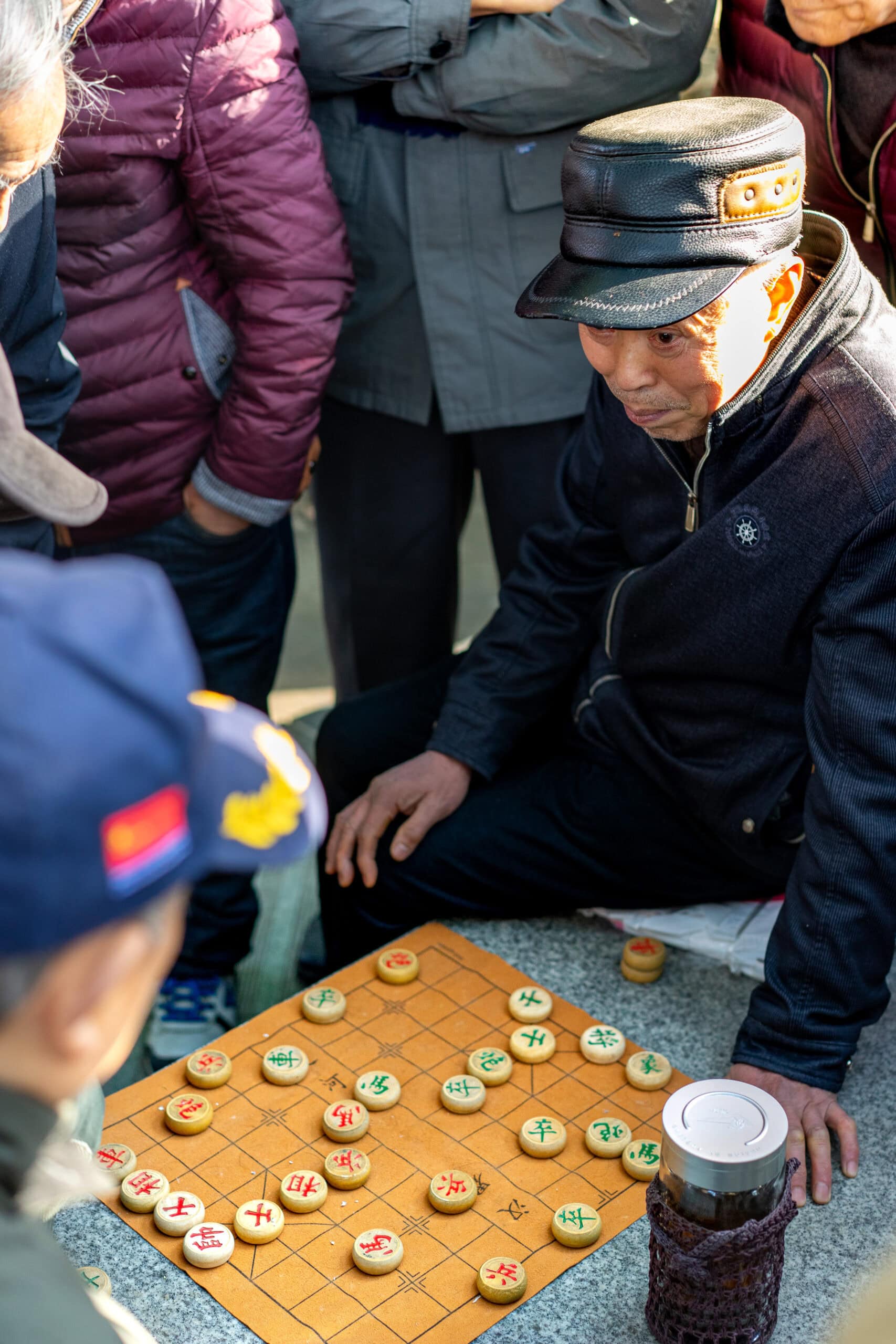 Tho elderly men playing Chinese chess in People's park, Chengdu