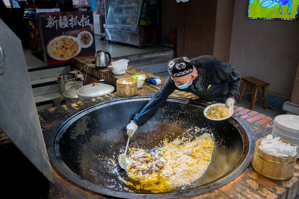 Polov is a meat rice dish often eaten for breakfast in Grand Bazaar Urumqi Xinjiang, China
