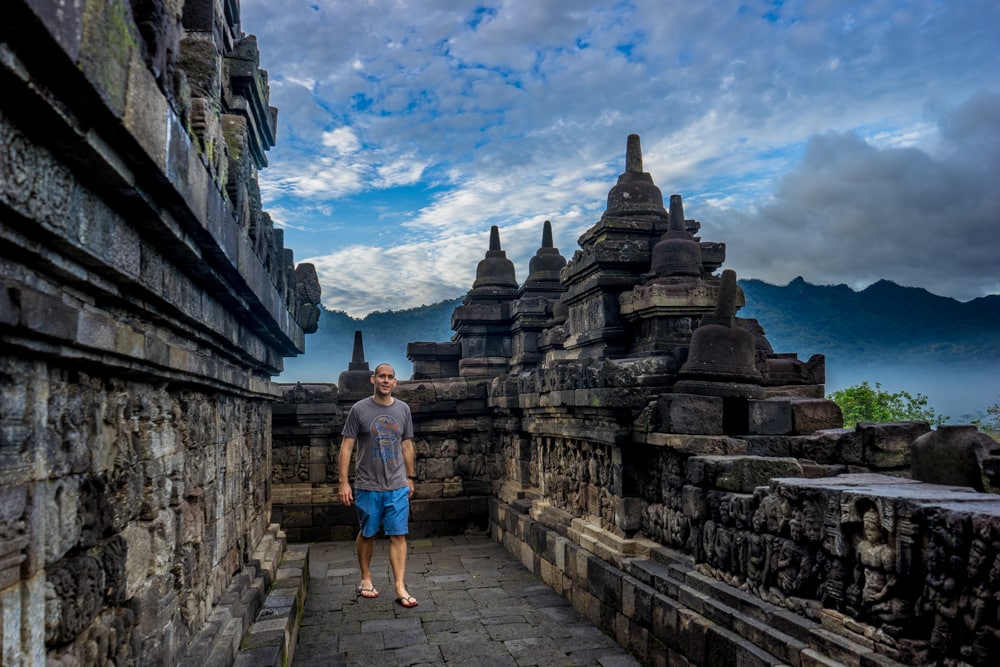 Traveller visiting a Buddhist temple in Java, Indonesia