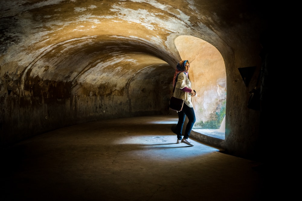 A women in the underground tunnels of the mosque in the Kraton, Yogyakarta