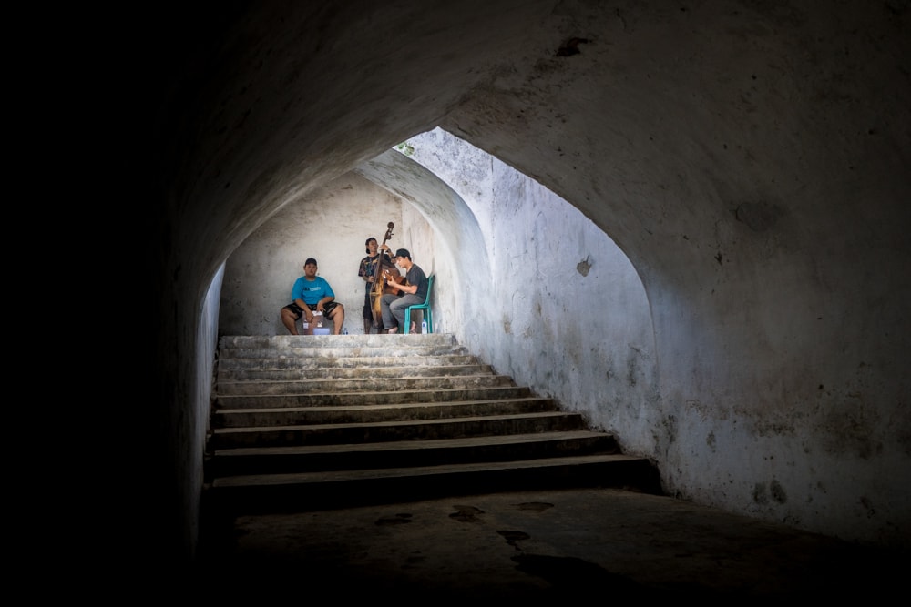Buskers making music in the underground mosque, Yogyakarta