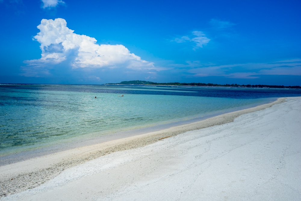White sand beach and clear blue waters on the island of Gili Meno, Indonesia