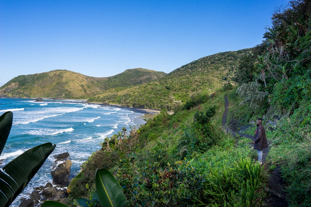 A man walking in the Silaka Nature Reserve during the Wild Coast hike in South Africa