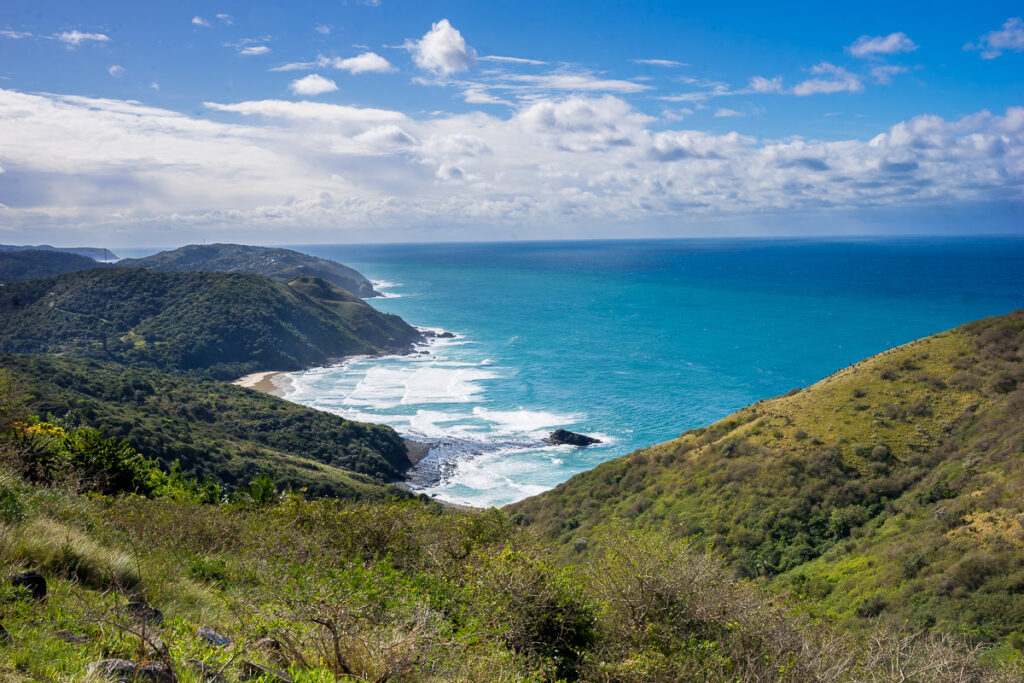The view from the top of Heartbreak Hill with the blue Indian Ocean and rolling hills