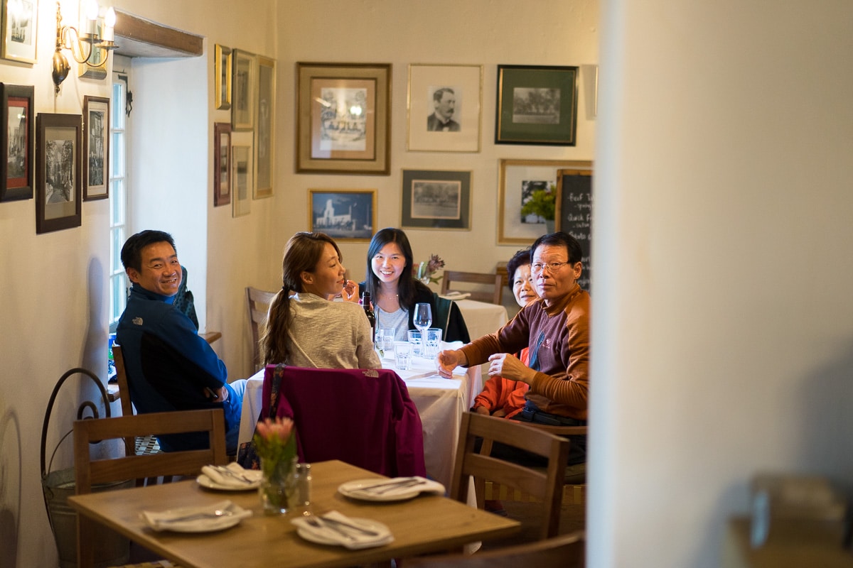Family having dinner at Jonkershuis, Groot Constantia