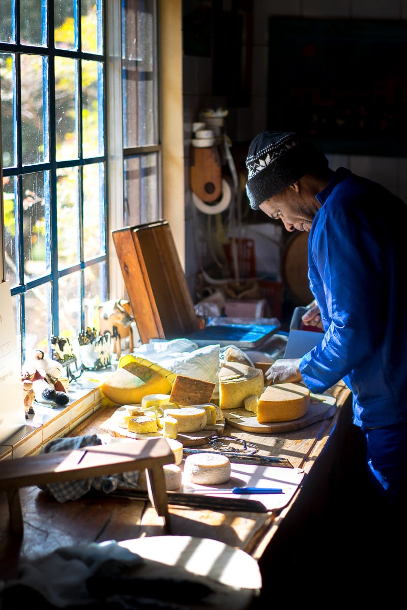 A worker cuts cheese at Wegraakbosch Cheese Farm in Magoebaskloof