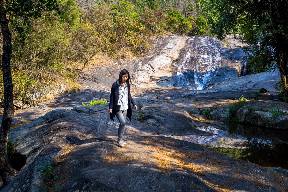 A woman walks in front of the Debengeni Falls in Limpopo province