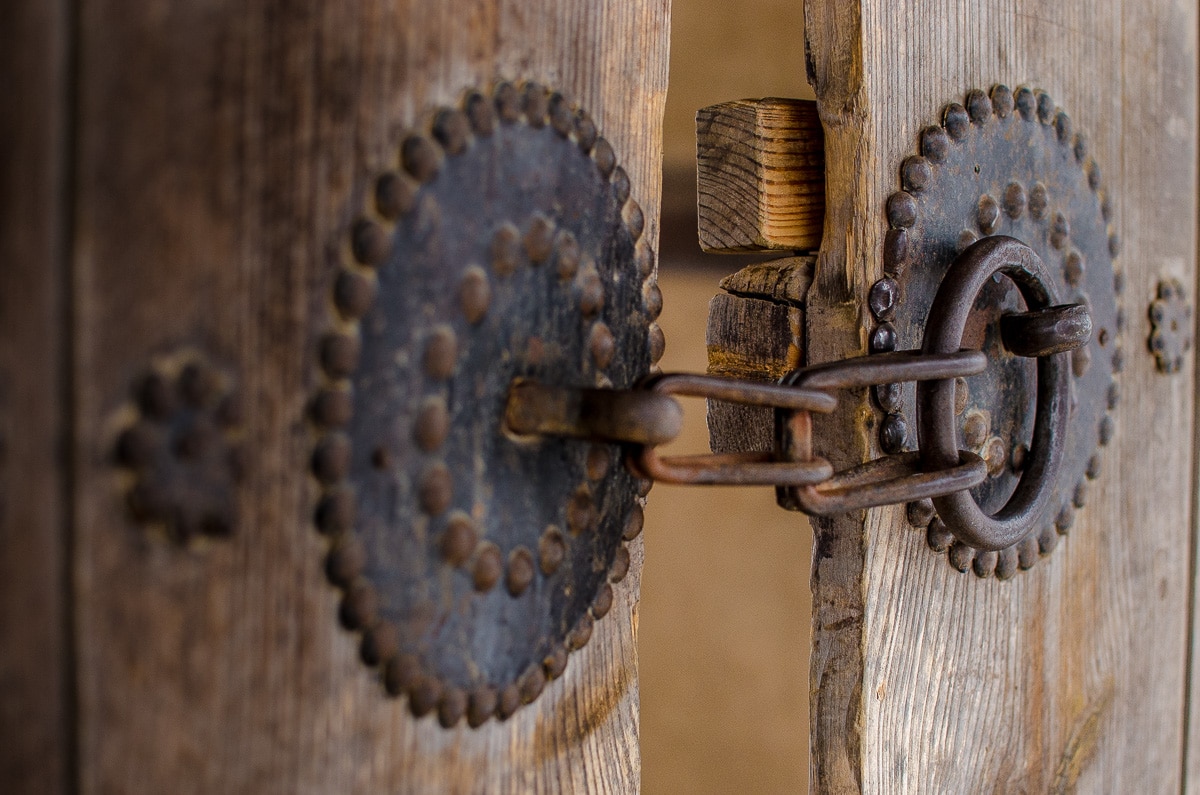 An old lock on a wooden door