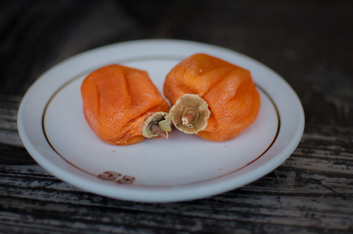 Two Dried Persimmons on a plate