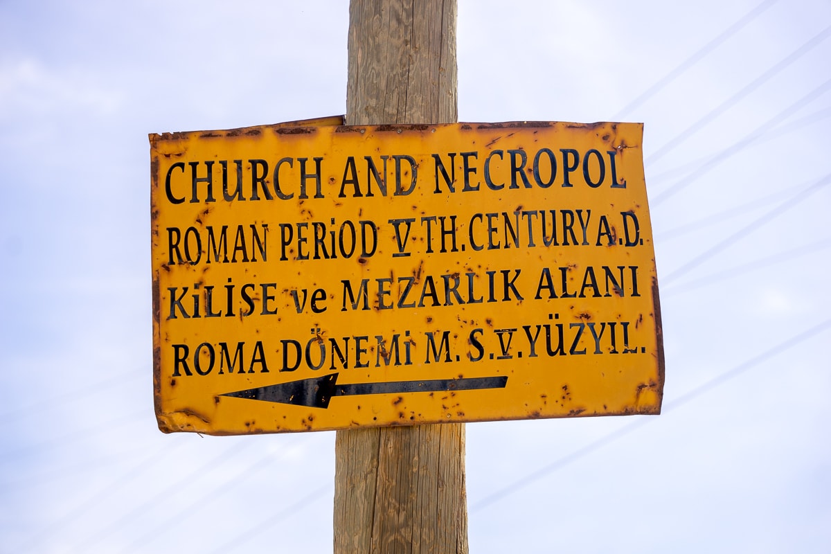 A signpost pointing the way to a church and Necropolis in Dara Ancient City