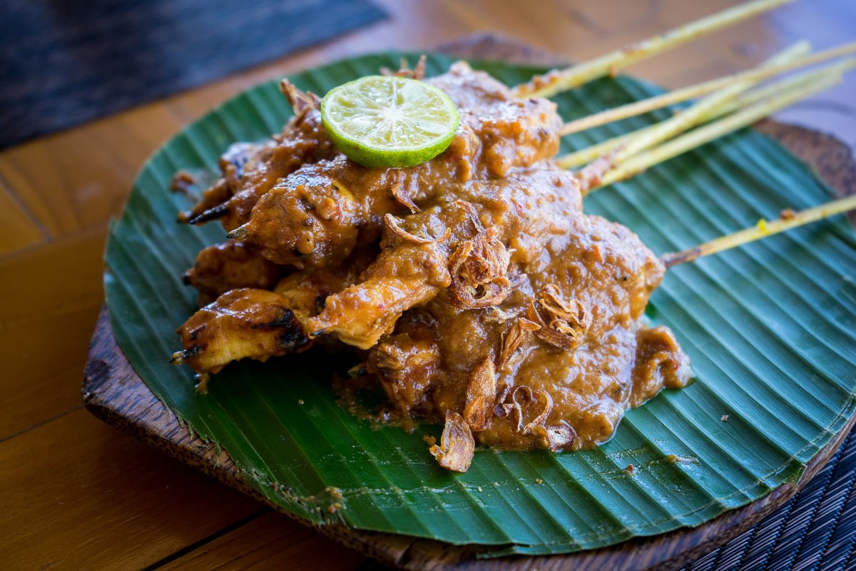 pork date served on banana leaf and peanut sauce