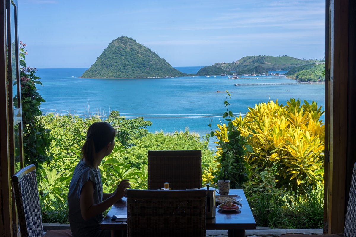 Jin having breakfast at Golo Hilltop overlooking the islands and sea