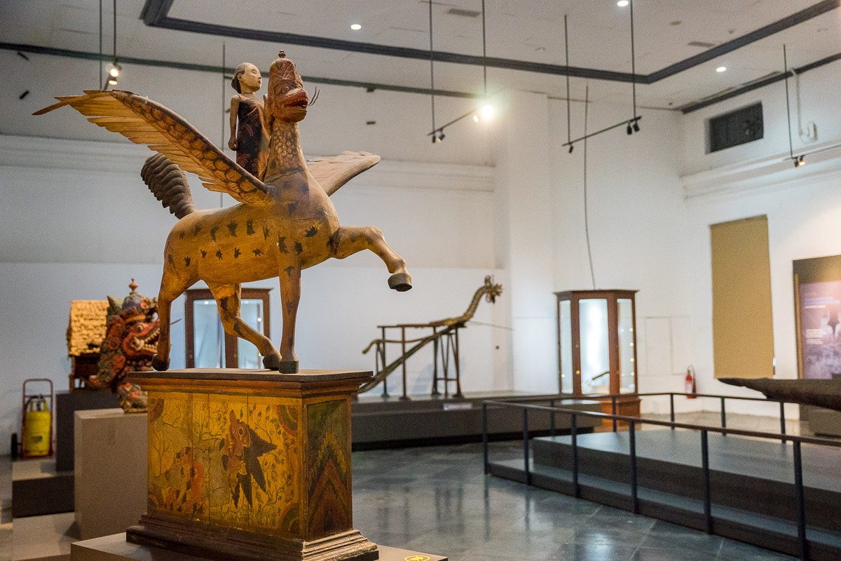 A wooden statue depicting Ratu Kidul, the Queen of the South Seas. 

She is standing on the back, riding a winged horse with a dragon's head. She is both loved for her compassion and feared for her destructive forces.