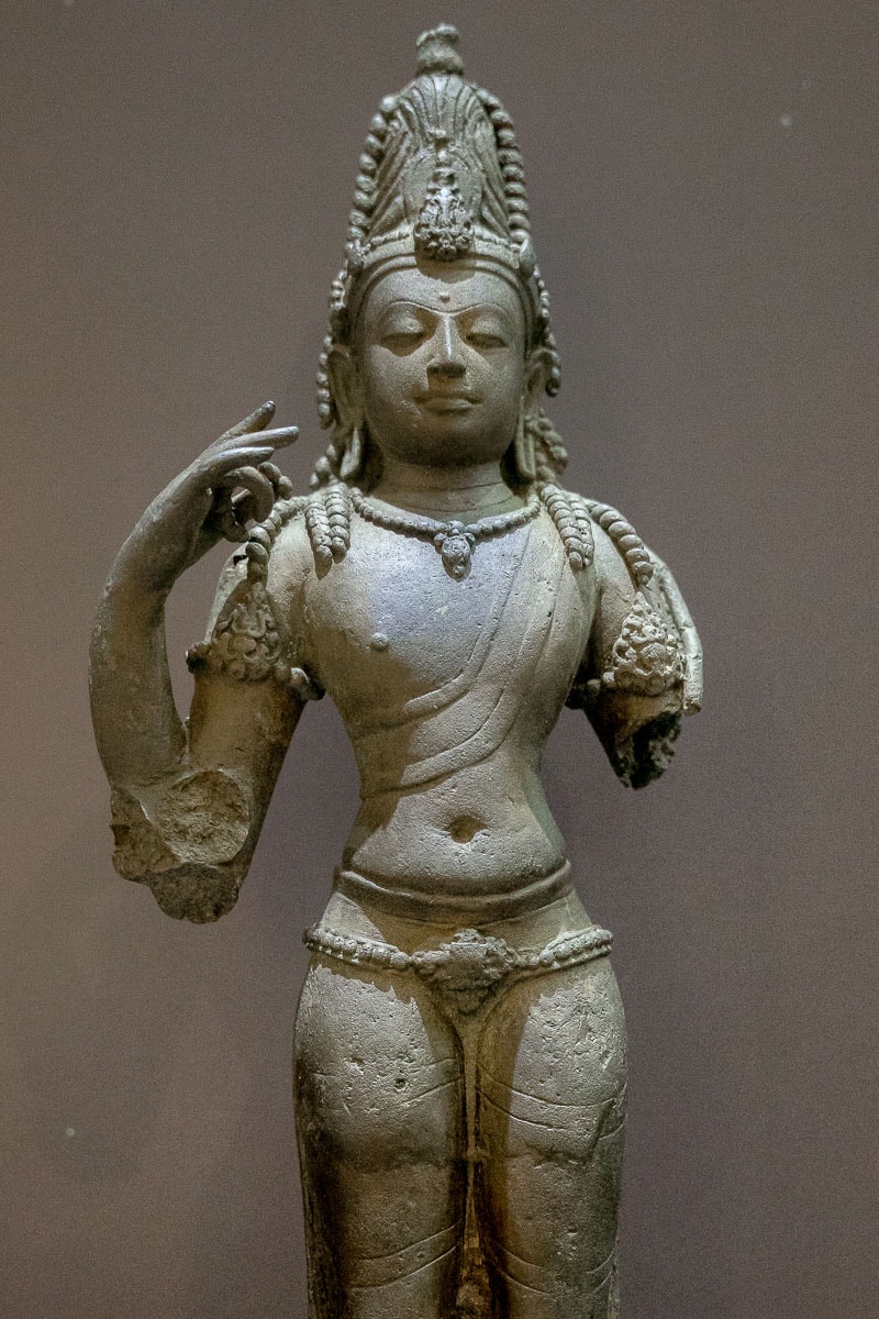 A standing Hindu god in bronze