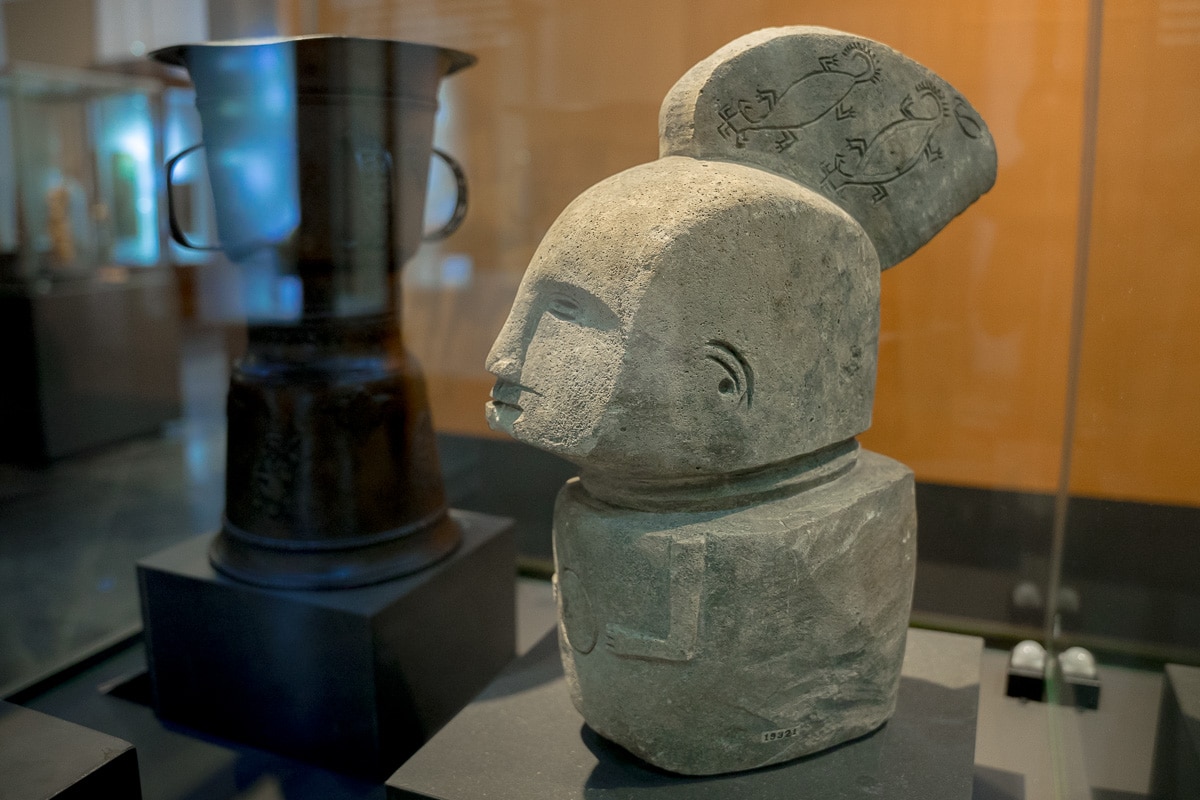 This stone statue from Timor is adorned with patterns resembling roosters, geckos, and scorpions. It almost looks like Maya or Aztec statues from the Americas. 