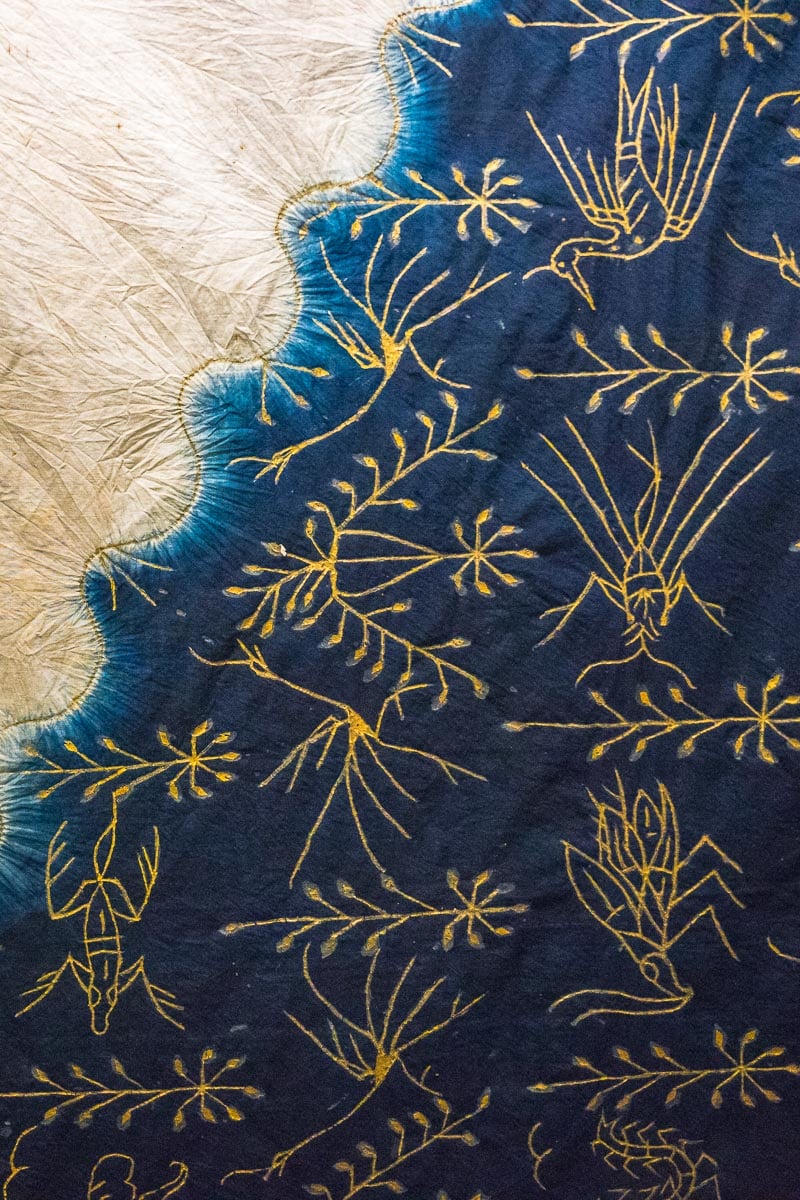 A bue, white and gold batik cloth in the Museum Nasional Indonesia. 
