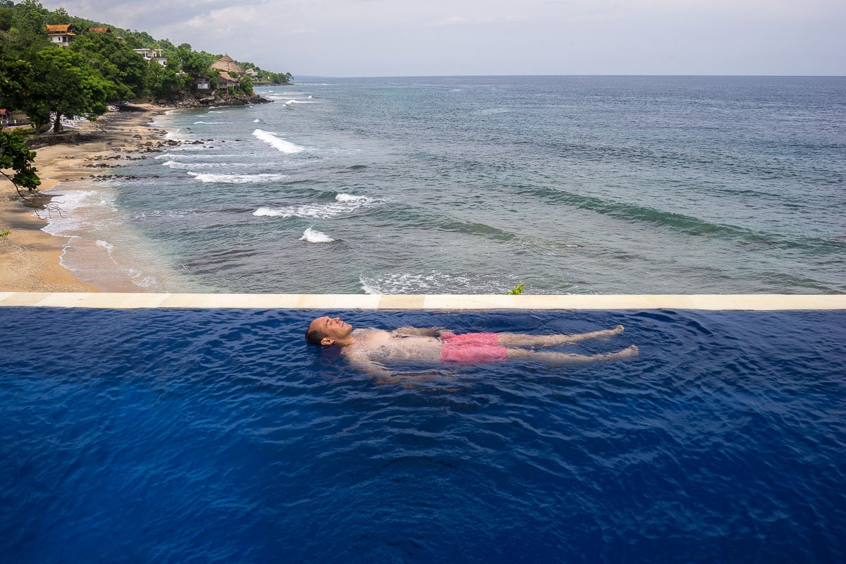 Me floating on my back in the infinity pool at Aquaterrace, Amed