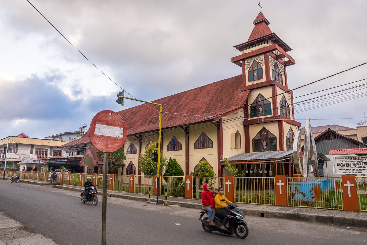 A church with a red corrugated iron roof church in Ruteng
