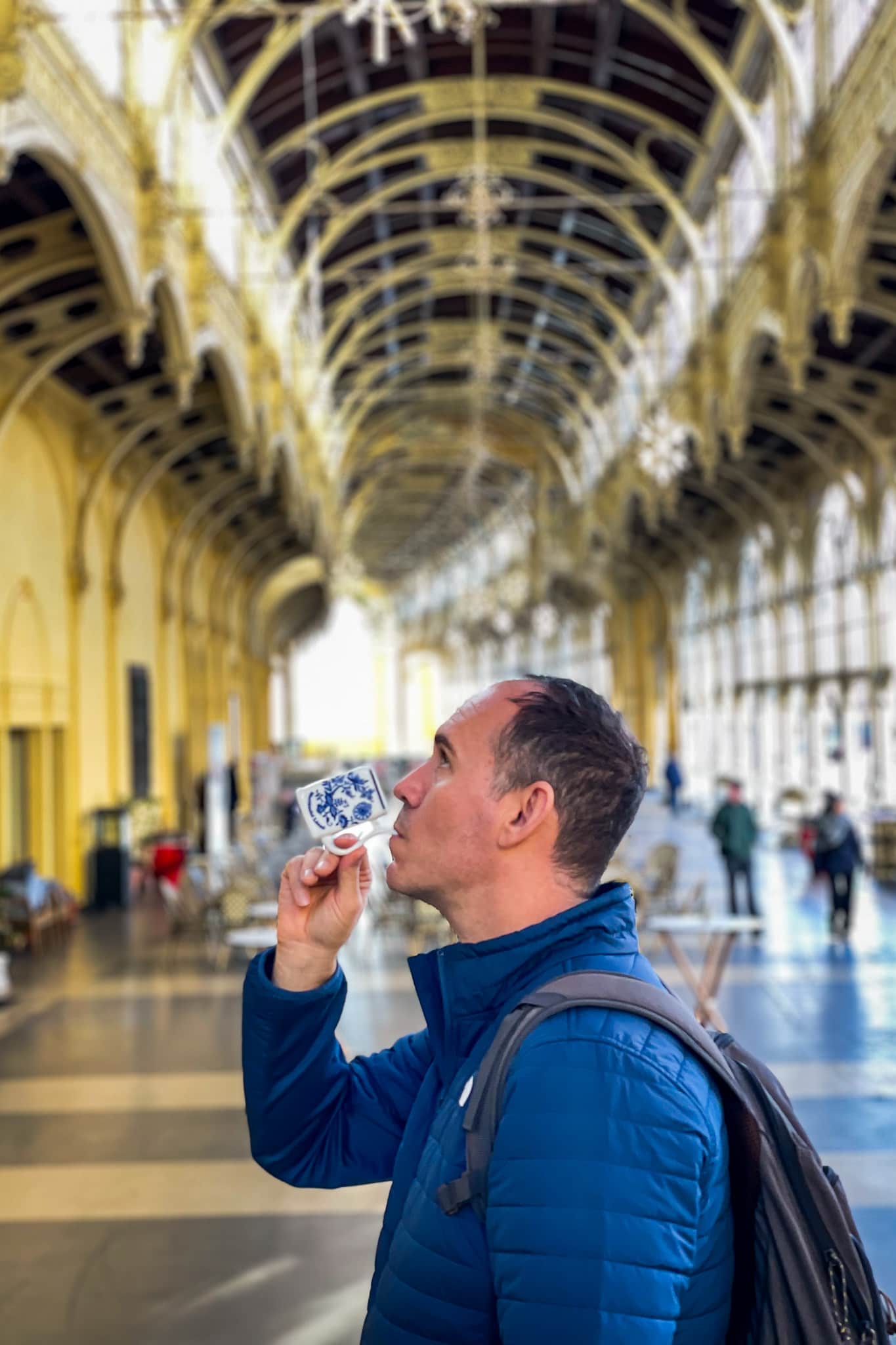 A photo of me drinking minreal water from a spring in the Spa Colonnade in Marianske Lazne in the Czech Republic