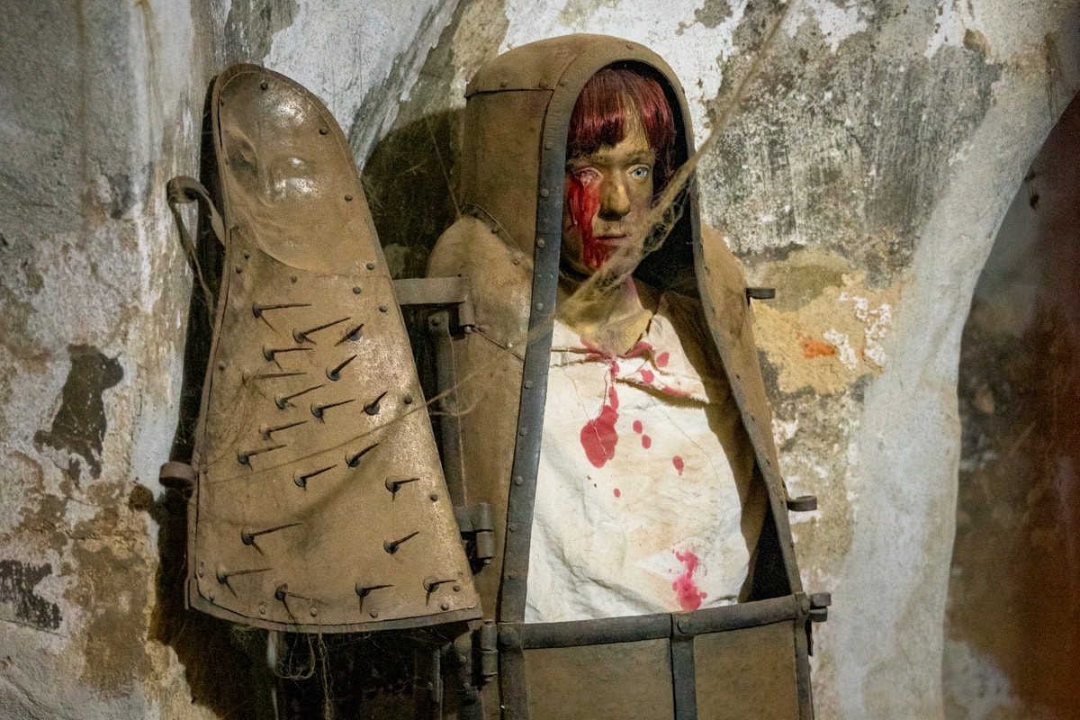 A display of medieval torture methods. This torturing device is called The Iron Maiden, and shows a person locket inside a spike iron coffin.
