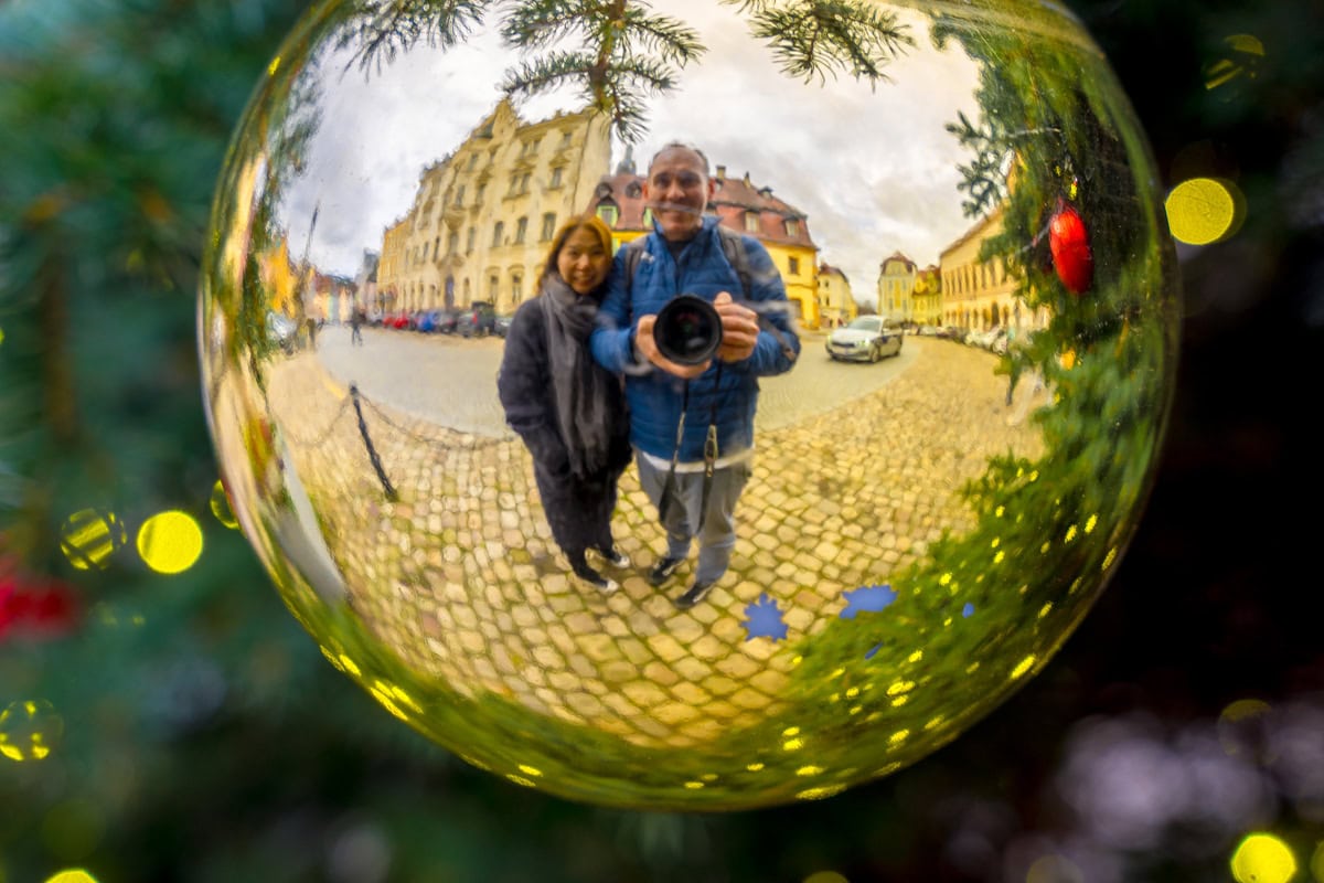  A photo of us reflected in a Christmas tree bauble on the town's Christmas tree. You can see the town hall and town square reflected behind us