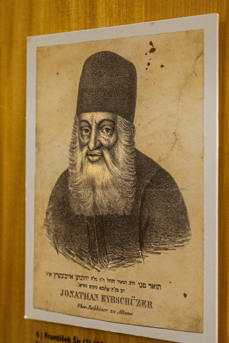 A sepia toned etching of a rabbi on display in the Maisel Synagogue