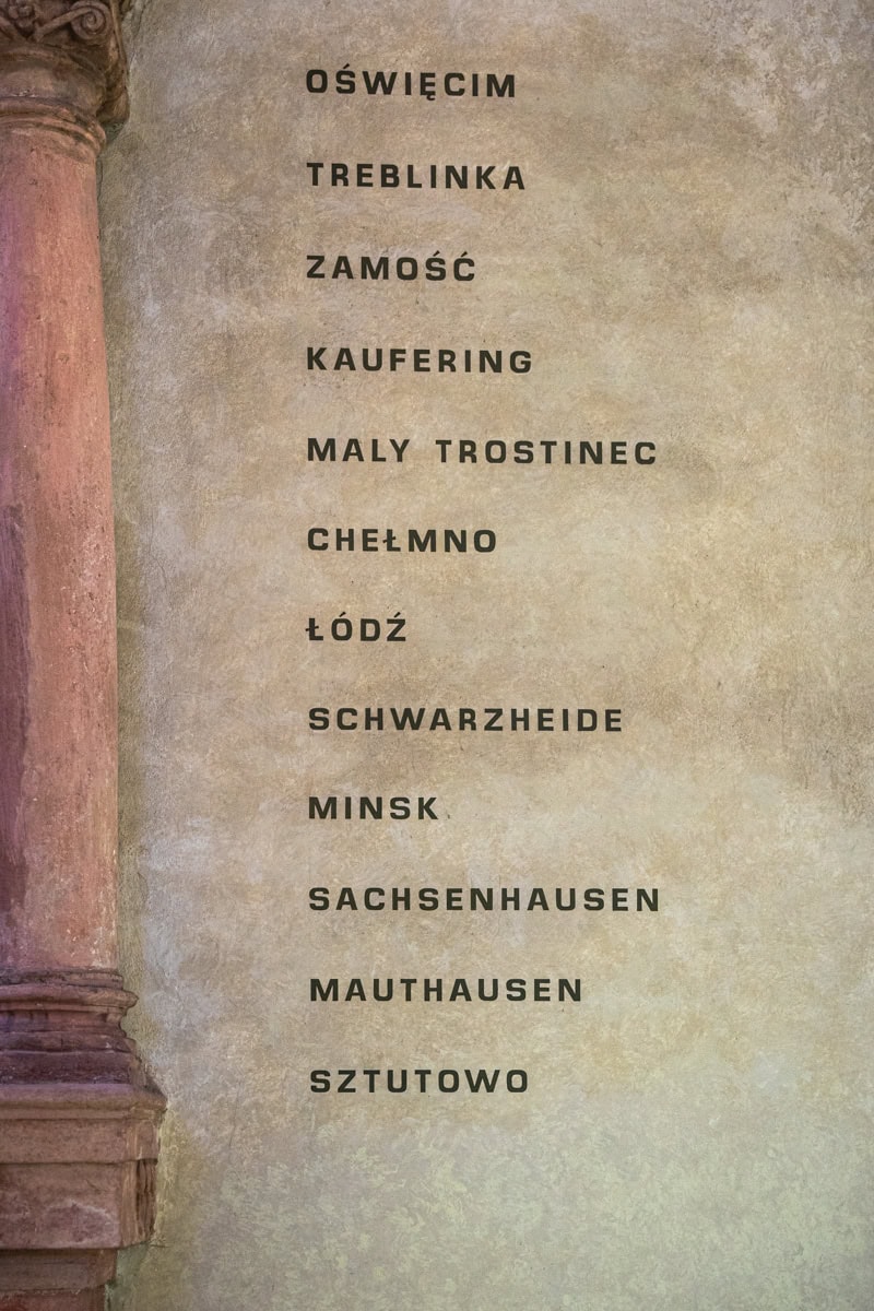 Names of concentration camps where the Jews of Prague were sent to inside the Pinkas Synagogue. They are Oswiecim (Auschwitz), Treblinka, Zamosc, Kaufering, Maly Trostinec, Chelmo, Lodz, Scharzheide, Minks, Sachenhausen, Mauthausen and Sztutowo