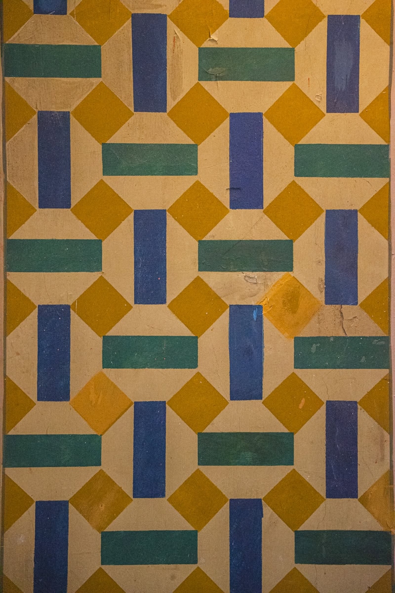A detail of patterns inside the Jerusalem Synagogue. This one is of geometric shapes in blue, yellow and teal