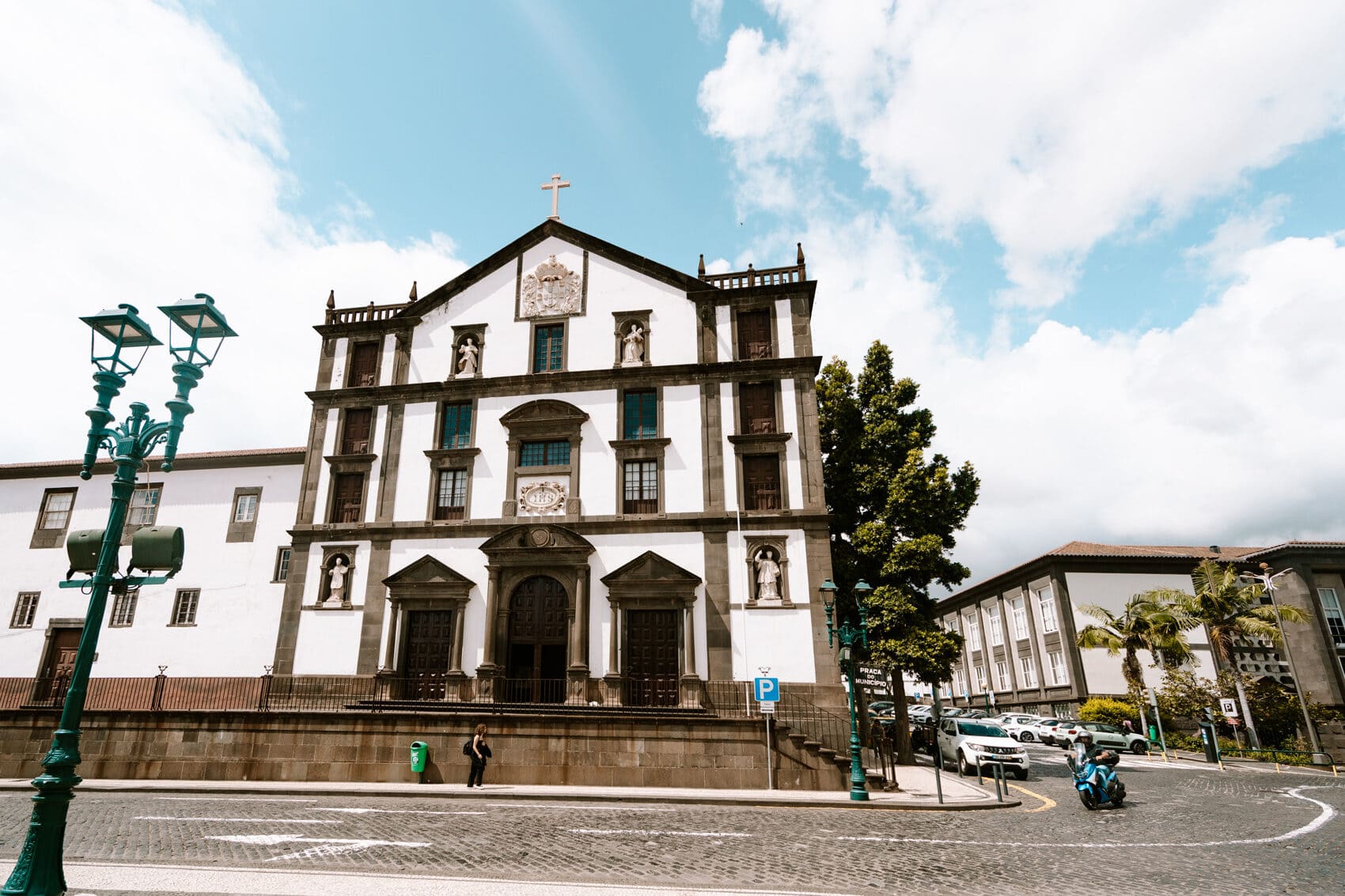 A street scene in Funchal, Madeira with a three story church