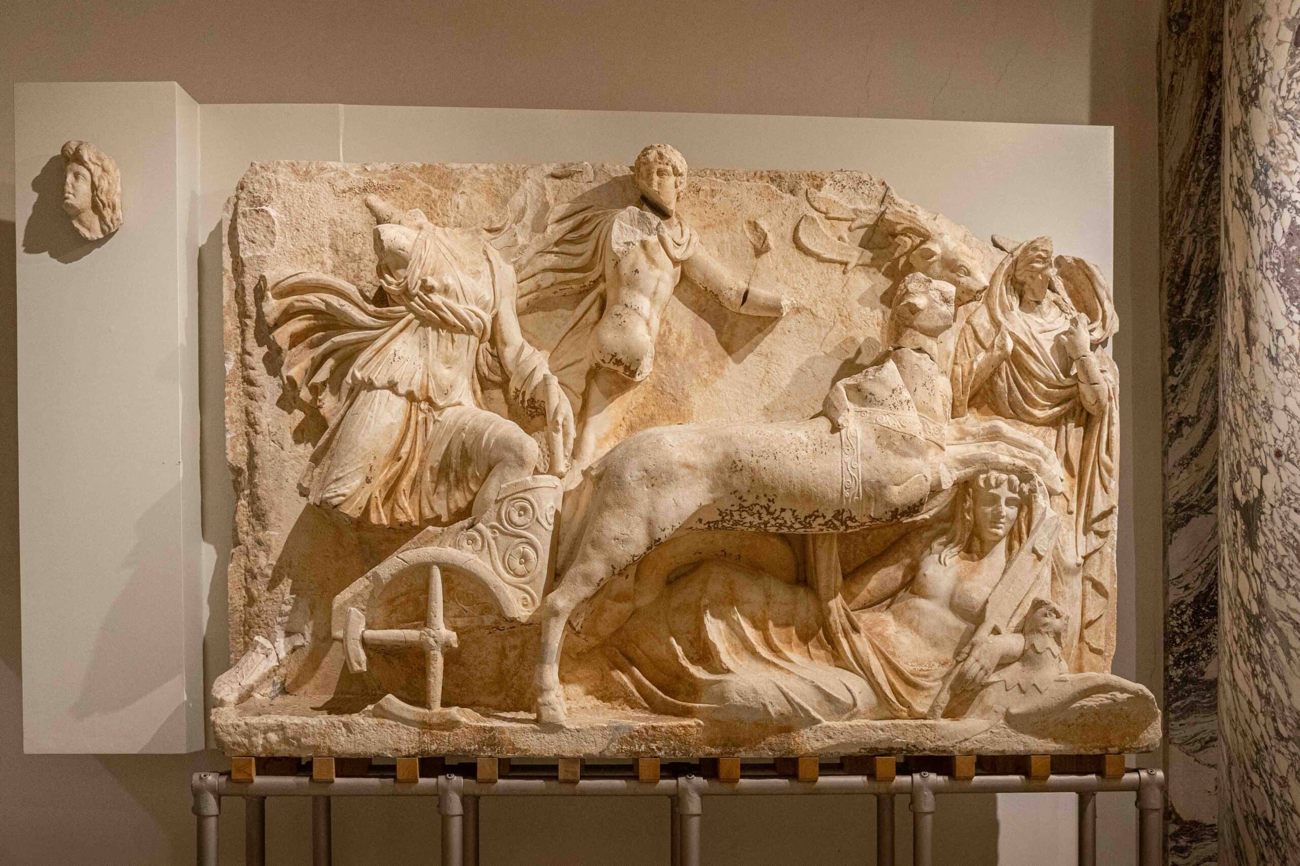 A marble relief fragment from the Ephesus Museum in Vienna depicting Apollo and Artemis riding their chariots