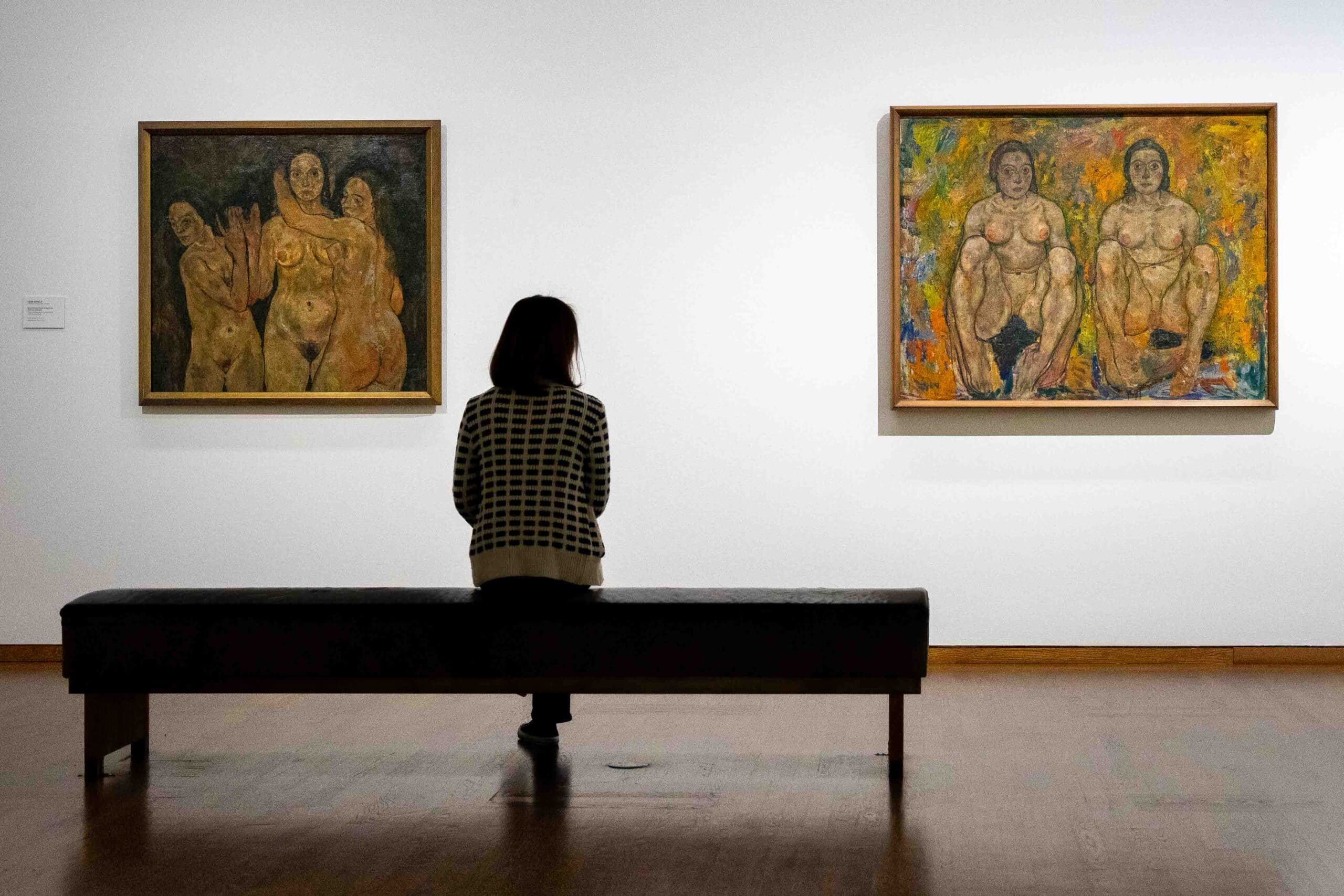 Jin sits and looks at Egon Schiele nude paintings in the Leopold Museum, Vienna