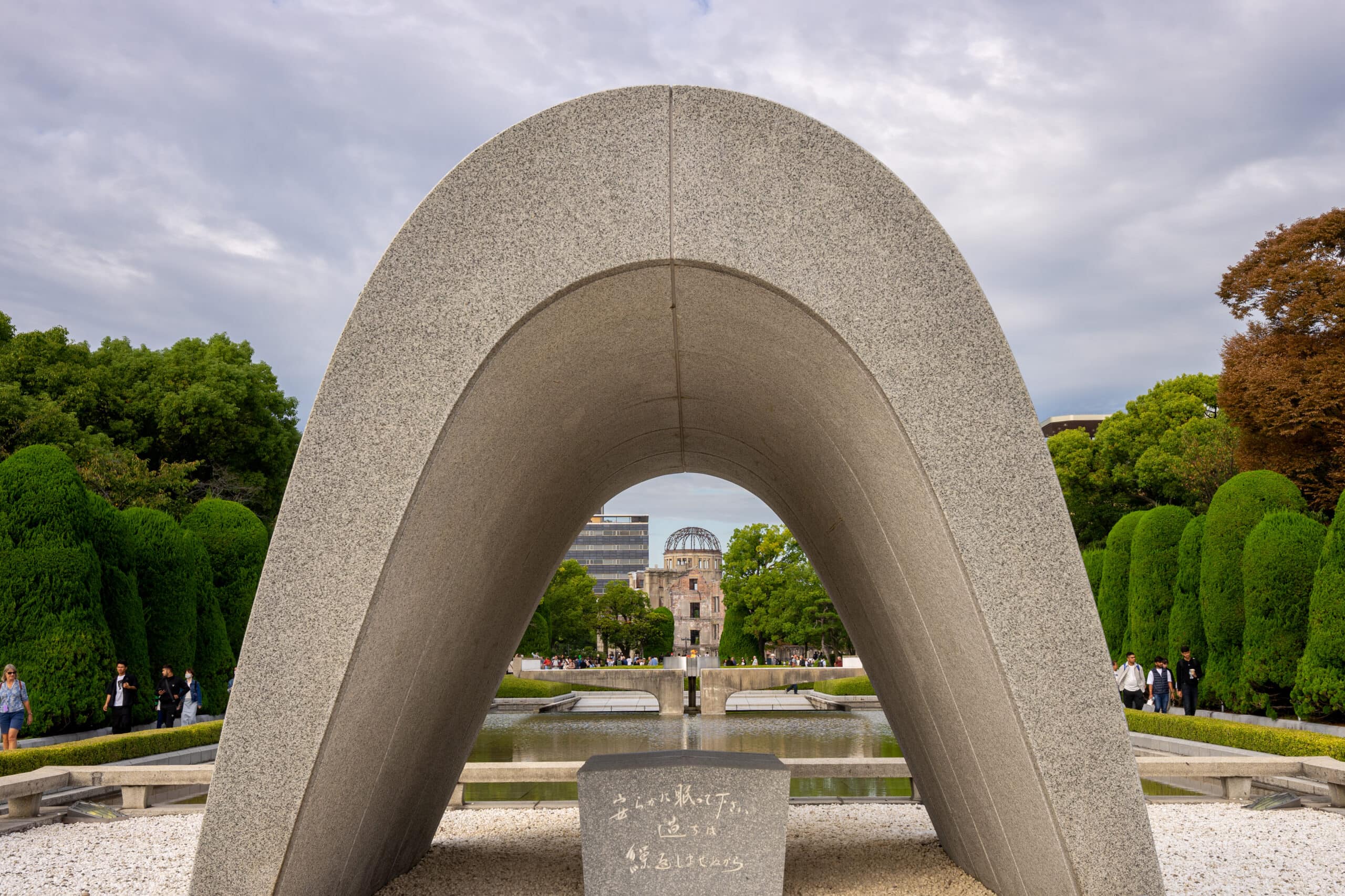 Hiroshima Victims Memorial Cenotaph. You can see the A-Bomb dome and the Peace Flame when looking through the saddle-shaped monument