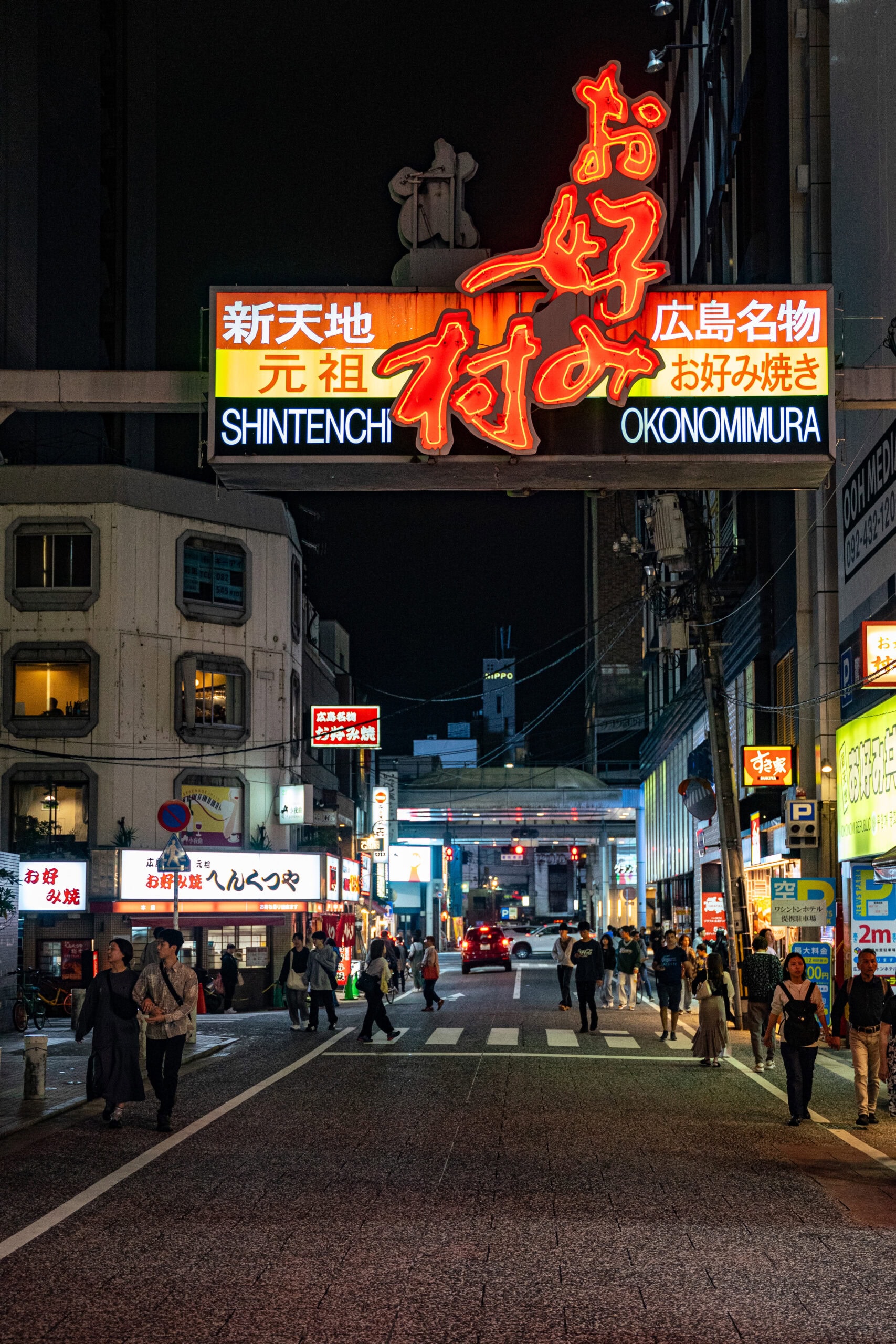 A neon sign at the entrance to  Okonomimuran Hiroshima