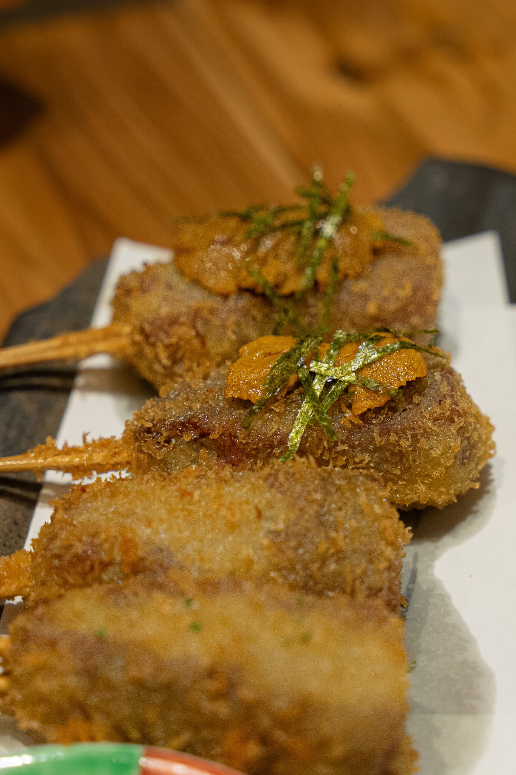 Deep fried beef skewers topped with sea urchin and seaweed that we had at Aiyo! Sanjo