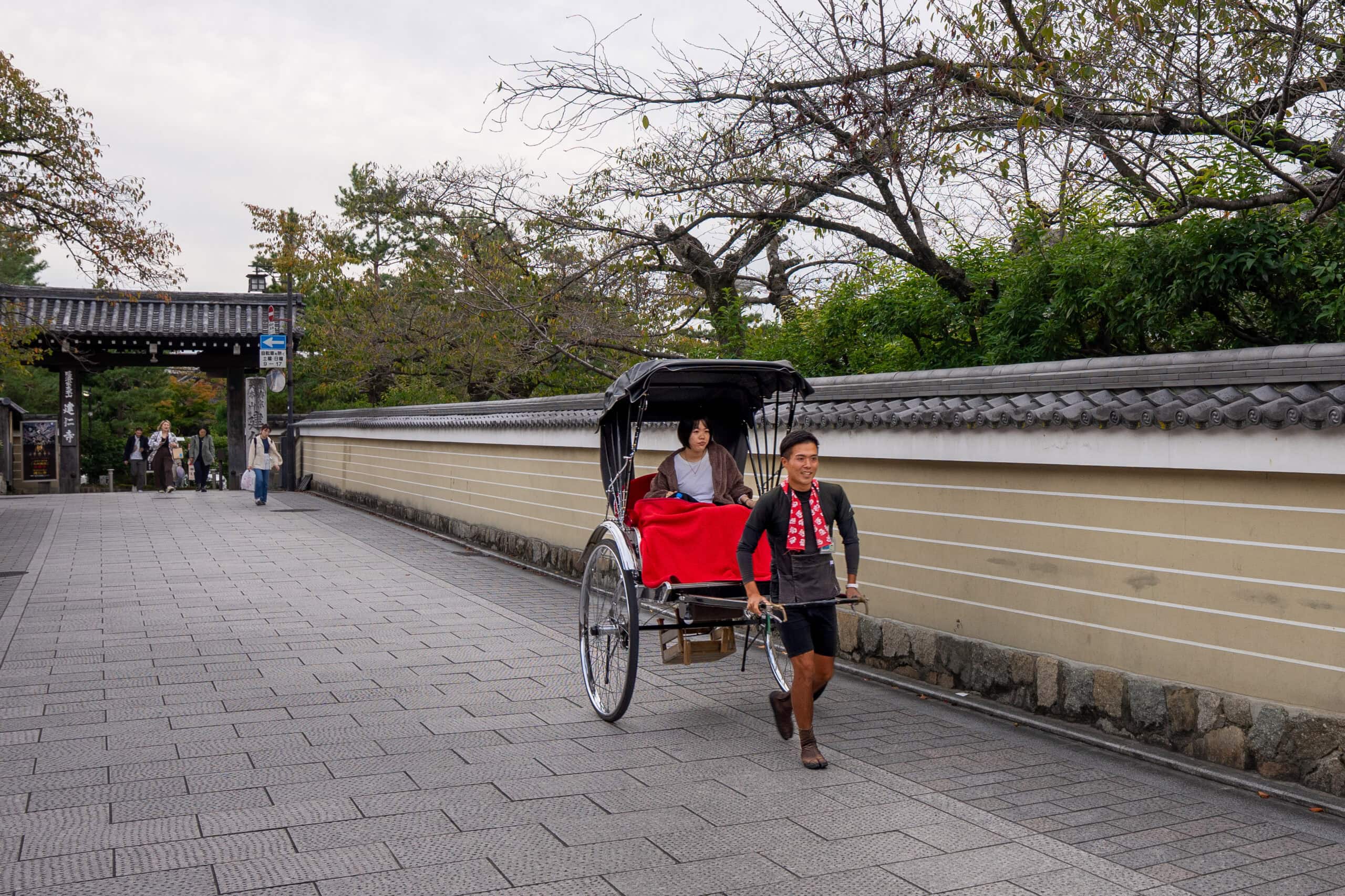 A jinrikisha taking a tourist around Kyoto