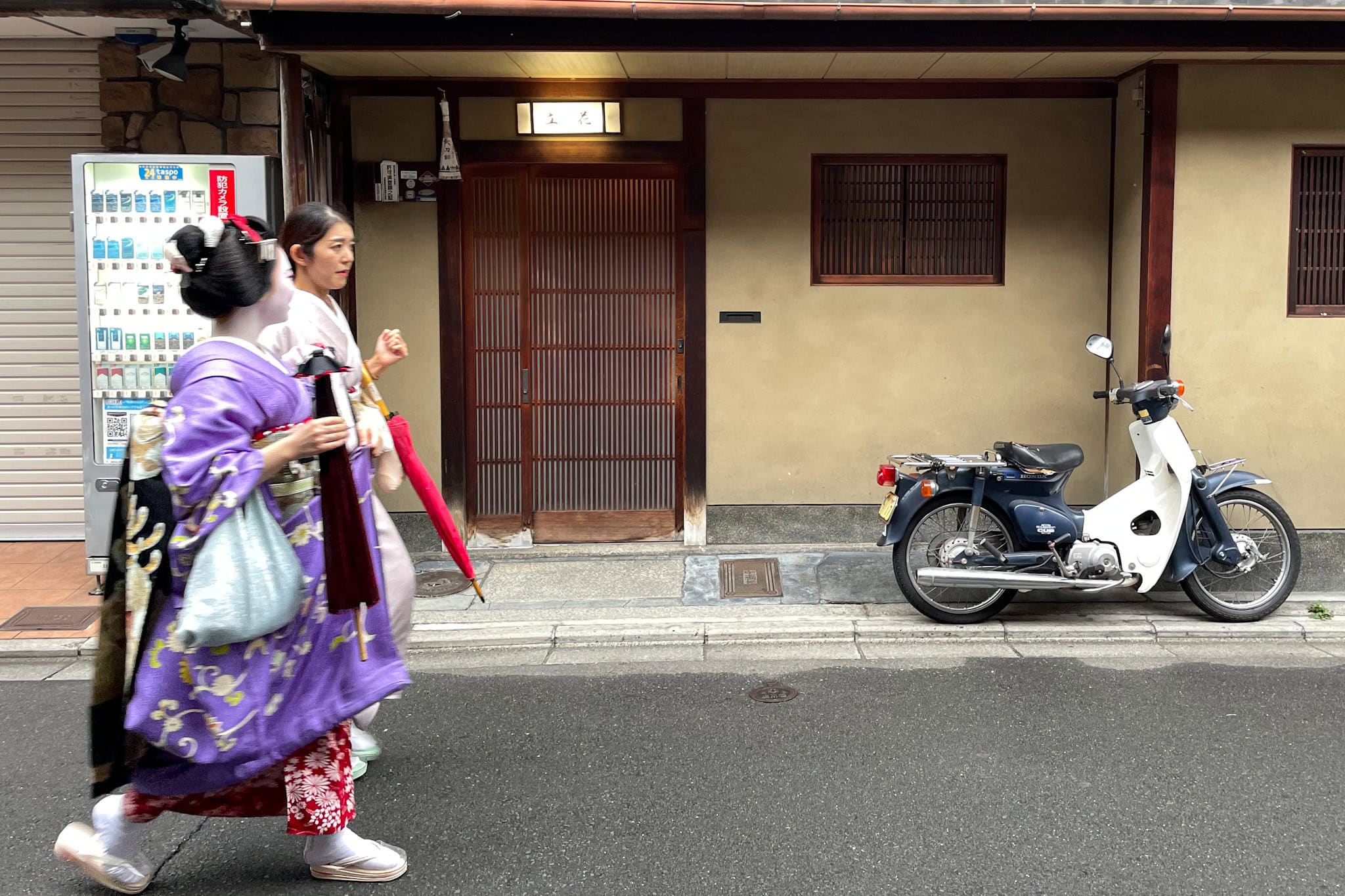 A maiko walks along the streets in Kyoto