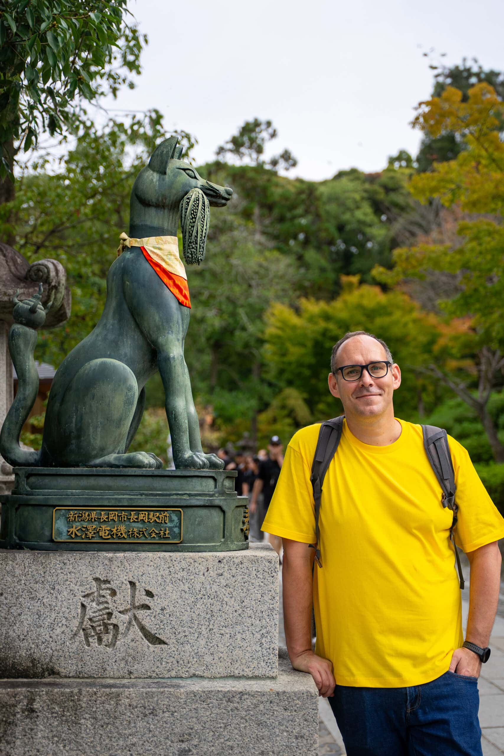 I am standing next to a fox statue,